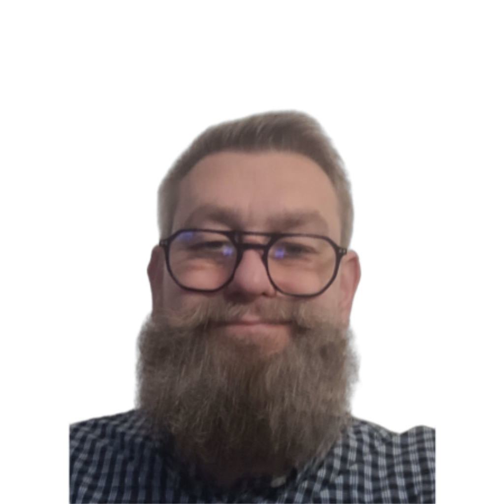 Xavier Lobez smiling in a blue plaid shirt and glasses
